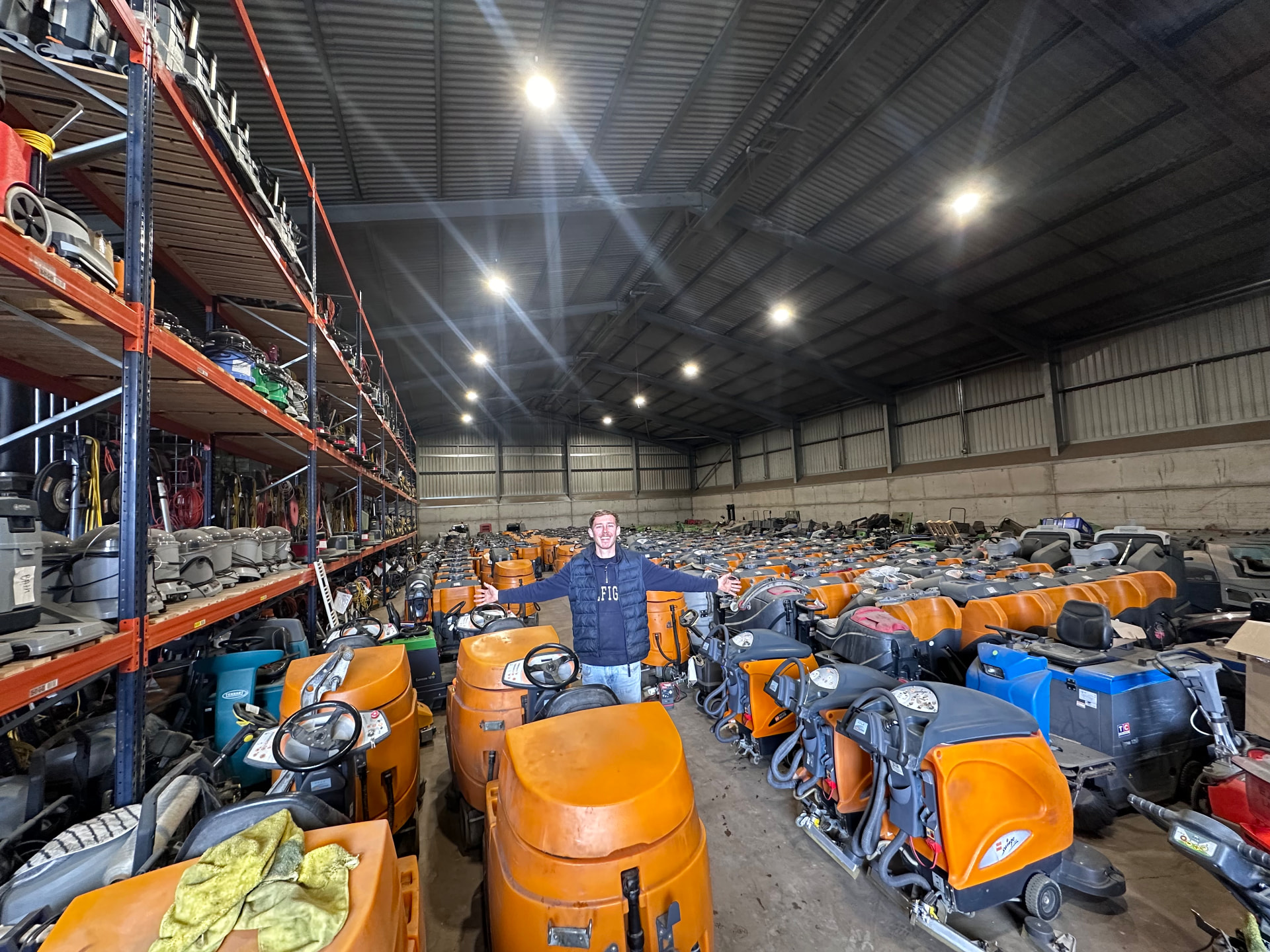 Cleanmachines warehouse in the Netherlands filled with rows of used scrubber driers